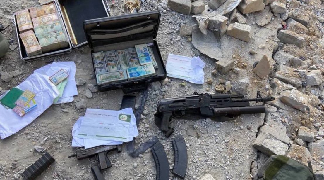 Hamas cash and weapons discovered in Gaza IDF photo