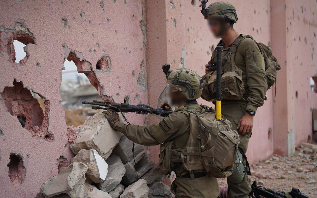 IDF troops shooting through wall IDF photo