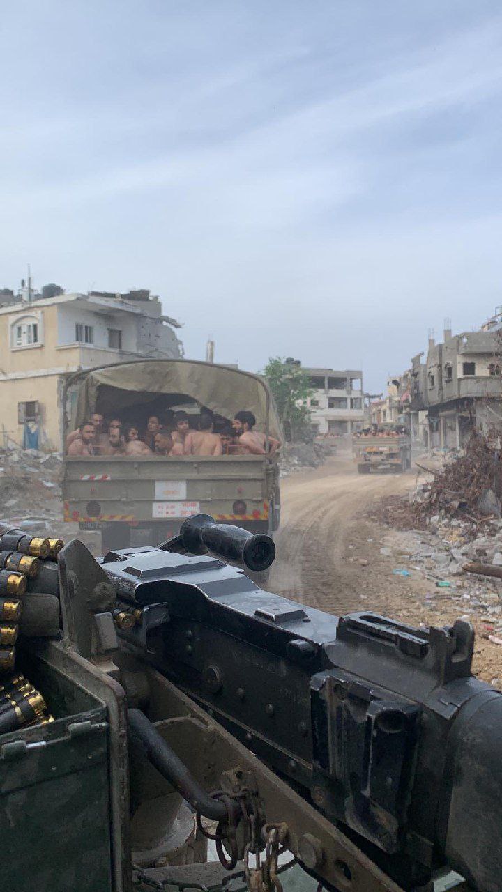 Hamas prisoners in IDF truck 