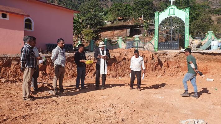 Fr Christopher Hartley and building site