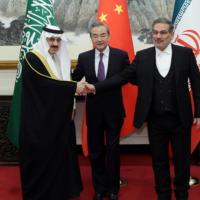 Saudi, Chinese, and Iranian diplomats shaking hands