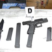 Confiscated weapons 2011 Tucson shooting FBI photo Wikimedia