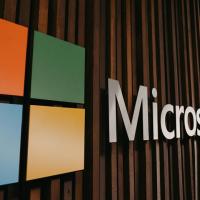 Office wall with Microsoft logo prominently displayed