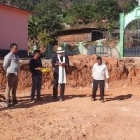 Fr Christopher Hartley and building site