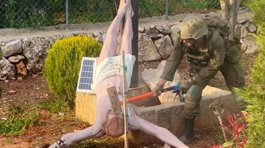 IDF soldier destroys a crucifix in Lebanon screen capture